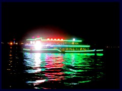 Illuminated tour ship on Pearl River at night.